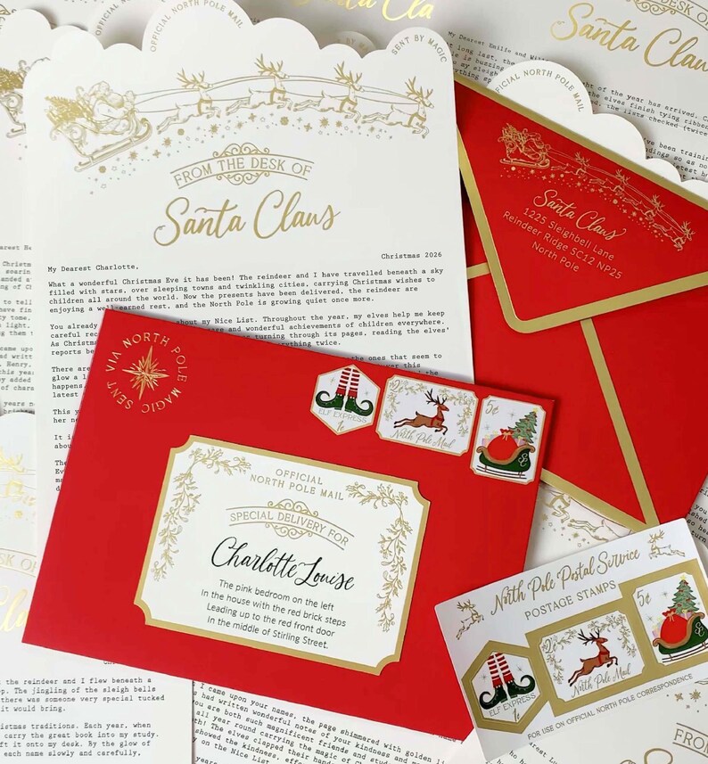 May include: A red envelope addressed to Charlotte Louise with gold foil accents, featuring North Pole postage stamps. Included is a letterhead from the desk of Santa Claus with a gold sleigh illustration and printed text detailing a Christmas message.