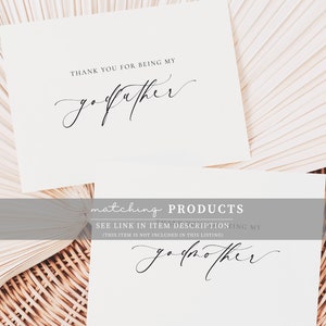 May include: Two white cards with black calligraphy. The top card says "Thank you for being my godfather." The bottom card says "Matching Products. See link in item description for my godmother. (This item is not included in this listing)"
