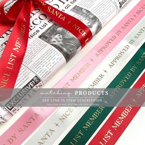 May include: A wrapped gift with a red ribbon that says "NICE LIST MEMBER" in gold lettering. Several ribbons in pink, white, and green with gold text that reads "APPROVED BY SANTA" and "NICE LIST MEMBER". The wrapping paper has a newspaper print.