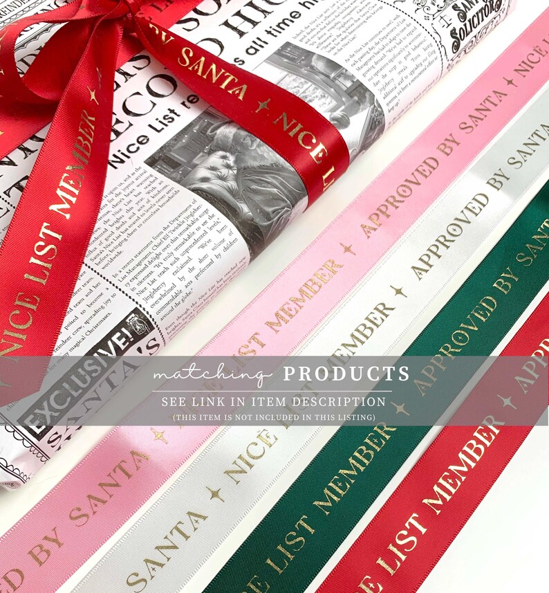 May include: A wrapped gift with a red ribbon that says "NICE LIST MEMBER" in gold lettering. Several ribbons in pink, white, and green with gold text that reads "APPROVED BY SANTA" and "NICE LIST MEMBER". The wrapping paper has a newspaper print.