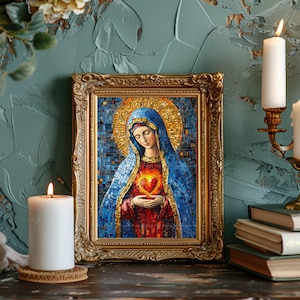May include: A framed mosaic artwork depicting a religious figure with a blue veil and a golden halo. The figure holds a heart, framed in a gold ornate frame. The artwork is illuminated by candles.