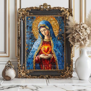 May include: A mosaic artwork of a religious figure, framed in black with ornate gold detailing. The figure wears a blue veil and holds a glowing heart. The mosaic is composed of small, colorful tiles. The artwork is displayed on a marble surface.