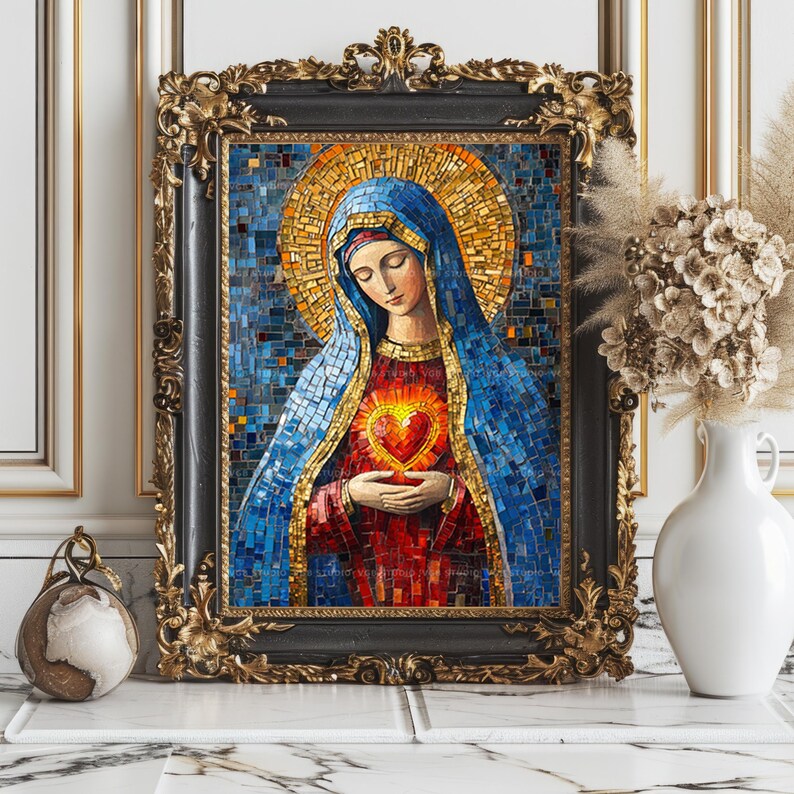 May include: A mosaic artwork of a religious figure, framed in black with ornate gold detailing. The figure wears a blue veil and holds a glowing heart. The mosaic is composed of small, colorful tiles. The artwork is displayed on a marble surface.