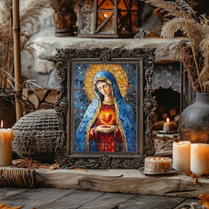 May include: A framed mosaic art piece depicting a religious figure with a blue veil and a golden halo. The figure holds a glowing heart. The frame is ornate, dark, and sits on a wooden surface with candles and decorative elements.