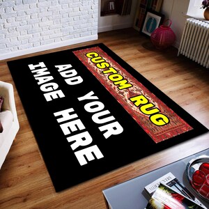 May include: Black and white rug with the text "Add Your Image Here" and "Custom Rug" in yellow. The rug has a red and white patterned design.