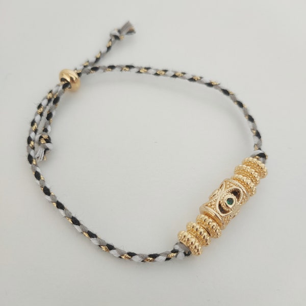 Bracelet avec perle tube zircons et cordon tressé métallisé noir