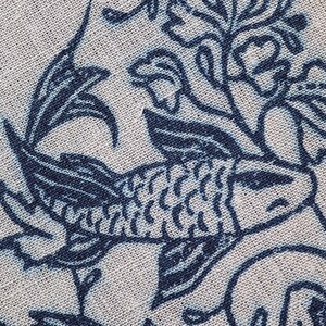 Closeup of linocut art print in indigo ink on natural irish linen featuring swimming koi fish and William Morris inspired botanical designs. Framed in a frame package. 8x10 inches.