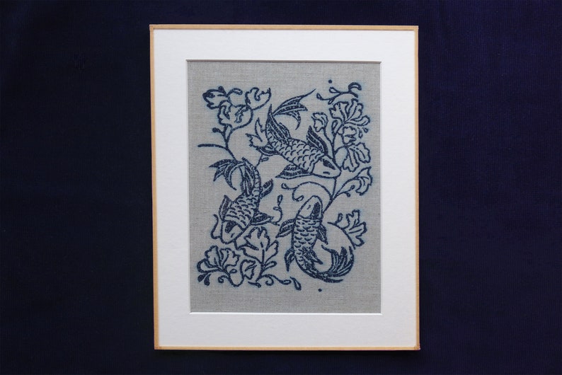 Linocut art print in indigo ink on natural irish linen featuring swimming koi fish and William Morris inspired botanical designs. Framed in a frame package. 8x10 inches.