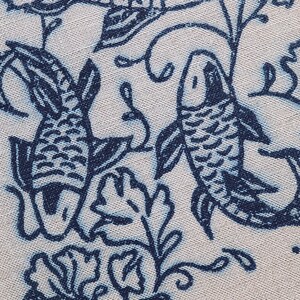 Closeup of linocut art print in indigo ink on natural irish linen featuring swimming koi fish and William Morris inspired botanical designs. Framed in a frame package. 8x10 inches.