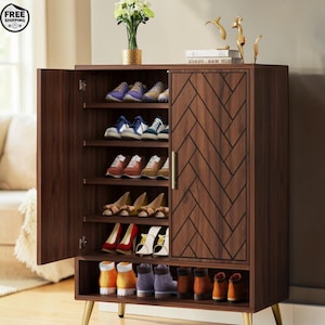 May include: A dark brown shoe cabinet with multiple shelves, displaying various shoes. The cabinet has a herringbone pattern on the door and gold-coloured legs. The left door is open, revealing the shoe storage.