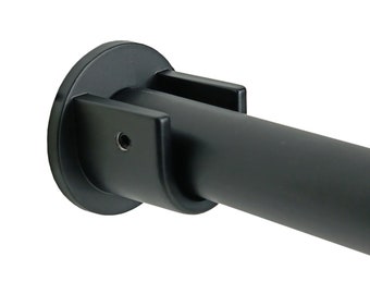 May include: Black metal shower curtain rod with a round end cap and a bracket. The rod is designed to be mounted to a wall.