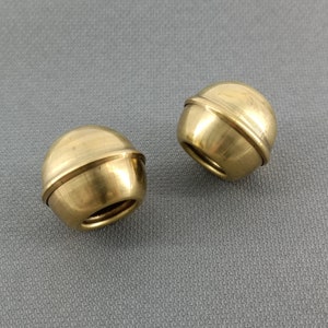 Handmade vintage pair of gold brass sheet small ball-shaped curtain rod finials