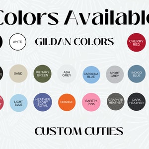 May include: A chart displaying the colour options available for Gildan clothing. The colours are grouped into two categories: Gildan Colours and Custom Cuties. The Gildan Colours include black, white, cherry red, light pink, dark chocolate, sand, military green, ash grey, Carolina blue, sport grey, indigo blue, and sapphire. The Custom Cuties colours include heather sport scarlet red, light blue, heather sport royal, orange, safety pink, graphite heather, dark heather, and navy.