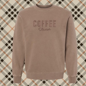 May include: A brown sweatshirt with the text "COFFEE Please" in a vintage style font.