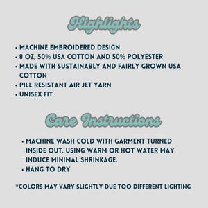 May include: A light teal graphic on a light gray background lists product highlights: machine embroidered design, 8 oz 50% USA cotton and 50% polyester, sustainably grown USA cotton, pill resistant air jet yarn, and unisex fit. Care instructions are also listed.