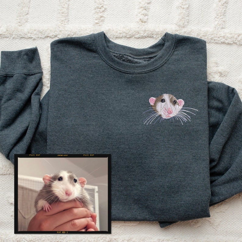 Gildan varsity crewneck sweatshirt in the color Dark Heather Grey with a custom embroidered pet rat stitched on the left chest.