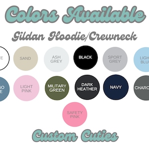 May include: A chart showing the color options available for Gildan hoodies and crewnecks. The colors include white, sand, ash grey, black, sport grey, light blue, indigo blue, light pink, military green, dark heather, navy, charcoal, and safety pink.