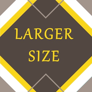May include: A brown diamond-shaped sign with yellow borders and white accents. The sign says "LARGER SIZE" in yellow text.