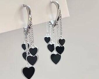 Black heart shaped dangling earrings