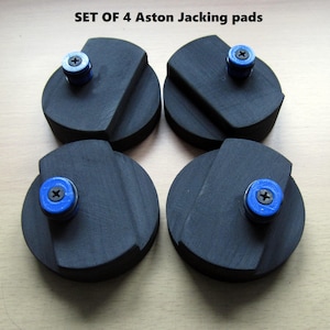 May include: Set of four black rubber jacking pads with blue and silver screw inserts.  The pads are designed to protect your car's undercarriage when using a jack.