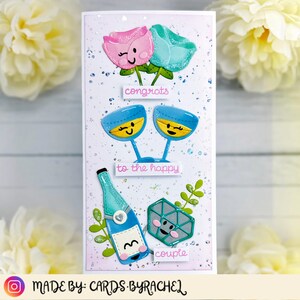 carte de mariage faite à la main avec des roses, un fond en feuille chaude, du champagne, des paillettes et une bague carlijn design lawn fawn félicitations au couple heureux