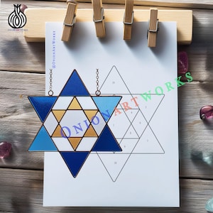 May include: A stained glass Star of David in shades of blue, white, and gold, hanging from a chain. The artwork is displayed on a white paper with a numbered diagram and the text "@OnionArtWorks".