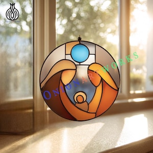 May include: A stained glass window depicting a religious scene. The circular design features figures in warm tones of brown and orange, with a blue circle at the top. The artwork is framed with black lines and has a hanging loop.