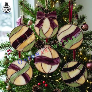 May include: Five stained glass ornaments featuring a segmented design in cream, sage green, and deep plum purple. Each round ornament is constructed with dark metal solder lines. One ornament includes a decorative stained glass bow at the top.