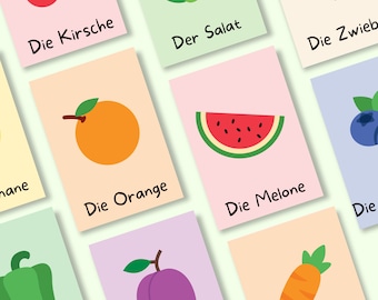 May include: Flashcards with colorful illustrations of fruits and vegetables, including a cherry, salad, onion, orange, watermelon, blueberry, bell pepper, plum, and carrot. Each card features the German word for the item pictured.