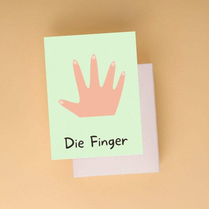 May include: A light green card with a pink handprint and the text "Die Finger" in black.