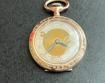 Reloj de bolsillo antiguo enrollado en oro rosa suizo de 15 joyas