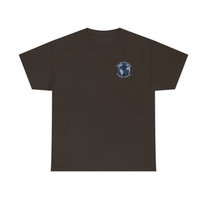 May include: A dark brown t-shirt with a blue and white graphic of a globe with a cross on it. The graphic says "You Are Created In God's Image".