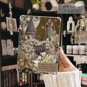 May include: A rectangular tablet case featuring a collage design with a castle, a full moon, stars, a butterfly, and floral elements. The text reads: I SOLEMNLY SWEAR THAT I AM UP TO NO GOOD and it does not do to dwell on dreams and forget to live.