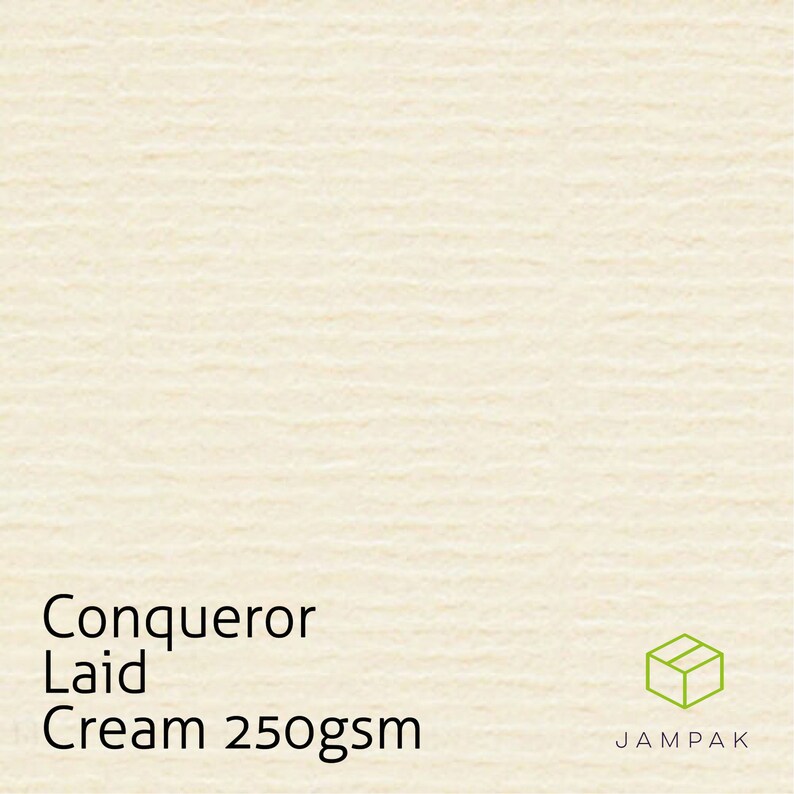 K&ouml;nnte beinhalten: Cremefarbenes Conqueror Laid Papier mit dem Text "Cream 250gsm" und einem kleinen Box-Logo mit dem Text "JAMPAK".