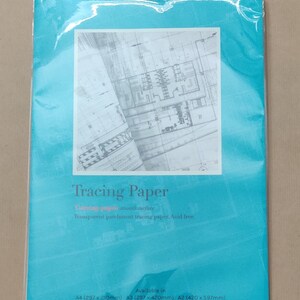 May include: A package of tracing paper with a smooth surface. The package is blue and has the text "Tracing Paper" in white. The text "Transparent parchment tracing paper. Acid free." is also printed on the package. The package is available in three sizes: A4 (297 x 210mm), A3 (297 x 420mm), and A2 (420 x 597mm).