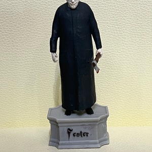Oom Fester Addams (Christopher Lloyd)