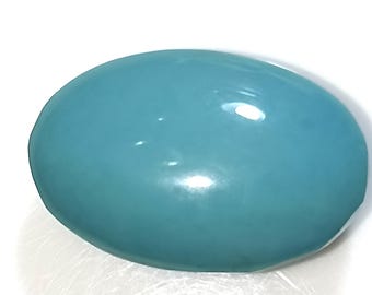 May include: A smooth, oval-shaped turquoise gemstone with a light blue hue.