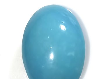 May include: A smooth, oval-shaped turquoise gemstone with a light blue colour.