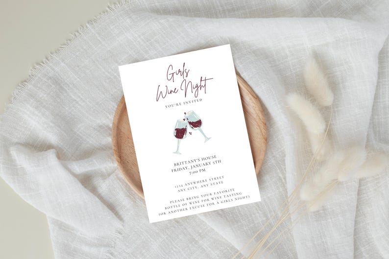 Ladies night "Girls Wine Night" invitation with white background, black font featuring two cheers-ing wine glasses. Minimalist design. Displayed as a printed invitation.