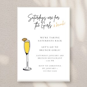 May include: A white invitation card with black text that reads "Saturdays are for the Girls & brunch!"  The card also includes a black and white illustration of a mimosa with a yellow orange slice. The text also reads "We're taking Saturdays back. Let's go to brunch girls! Saturday January 3rd Brunch Restaurant 1:00 PM RSVP to Christina by January 777-867-5309"