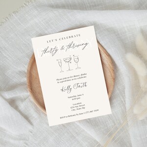 "Thirty and Thriving" birthday invitation with light pink background and black font featuring cocktails.