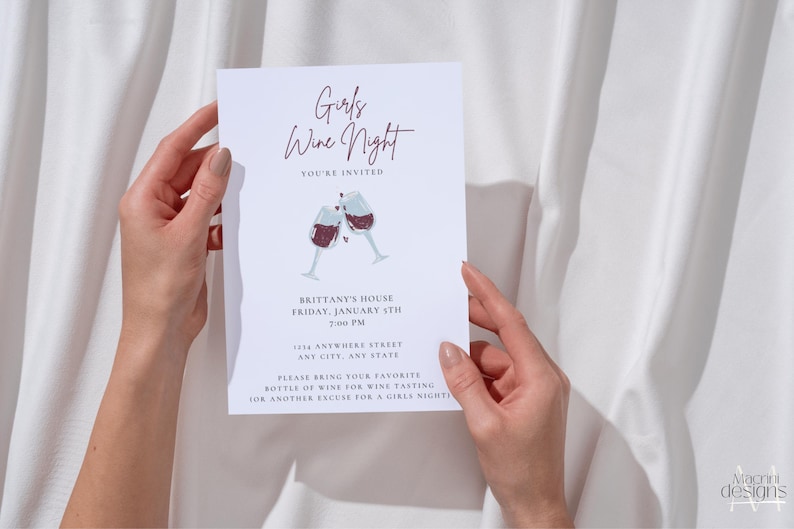 Ladies night "Girls Wine Night" invitation with white background, black font featuring two cheers-ing wine glasses. Minimalist design. Displayed as a printed invitation.