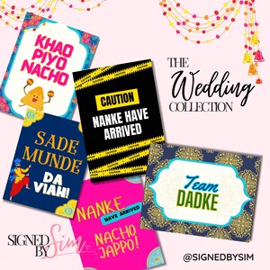 May include: A set of five colourful printable signs with text in English and Hindi. The signs feature a variety of designs, including a cartoon character, a turbaned man, and a traditional Indian pattern. The text on the signs includes phrases like "Khao Piyo Nacho", "Sade Munde Da Viah", "Nanke Have Arrived", and "Team Dadke".