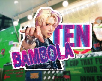 May include: A sticker featuring a portrait of a person with pink and blonde hair, wearing a black leather jacket and silver jewelry. The sticker has the text "TEN" and "BAMIBOLA" in a colorful, stylized font.