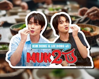 May include: A sticker featuring two men eating, with the text "KIM DONG & LEE DONG of: MUK2US" in red and white letters.