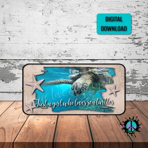 May include: A black and white license plate with a sea turtle swimming in blue water. The text "Just a girl who loves sea turtles" is written on the plate.