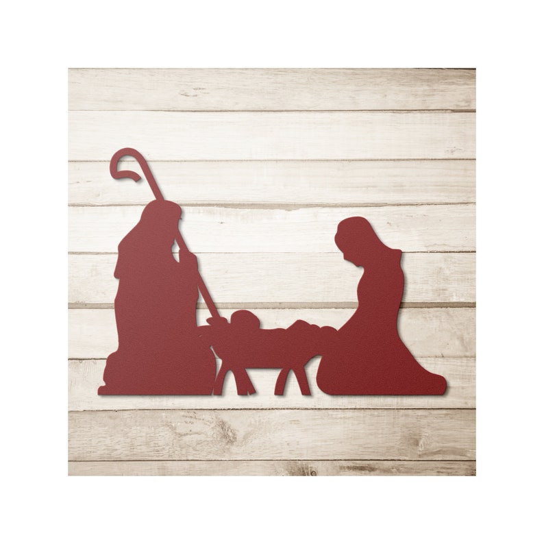 May include: Red metal silhouette of the nativity scene with Mary, Joseph, and baby Jesus in a manger.