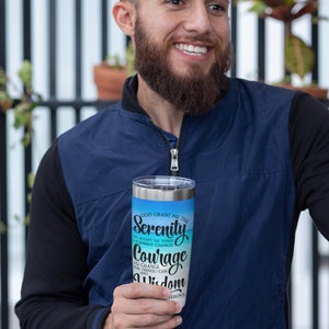 May include: A stainless steel tumbler with a blue and white design. The tumbler features the text "God grant me the Serenity to accept the things I cannot change. Courage to change the things I can. And Wisdom to know the difference."
