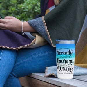 May include: A stainless steel tumbler with a blue and white ombre design. The tumbler features the text "God grant me the Serenity to accept the things I cannot change, Courage to change the things I can, and Wisdom to know the difference."