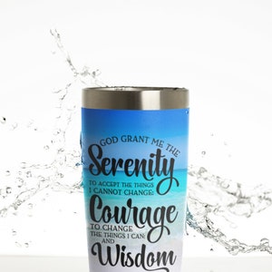 May include: A stainless steel tumbler with a blue and white ombre design. The tumbler features the text "God grant me the Serenity to accept the things I cannot change: Courage to change the things I can: and Wisdom to know the difference."